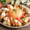 67. Beyti Spezial - Dönerfleisch eingerollt in Yufka-Fladen mit Salat, Tomaten-Joghurt-Soße und Rels